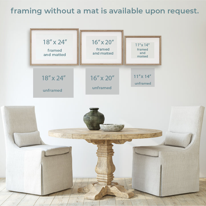 a table with two chairs and a vase on it