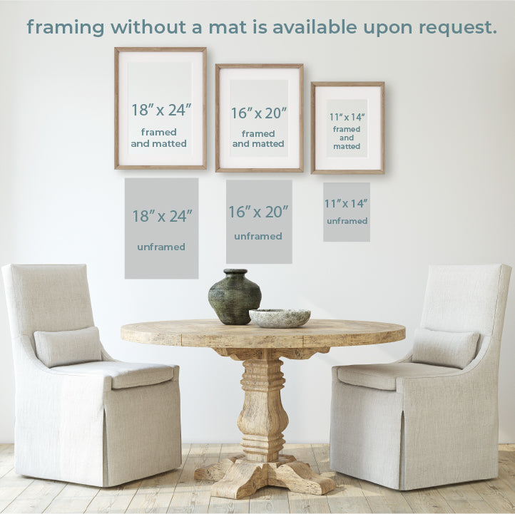 a table with two chairs and a vase on it