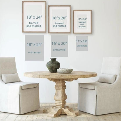 a table with two chairs and a vase on it